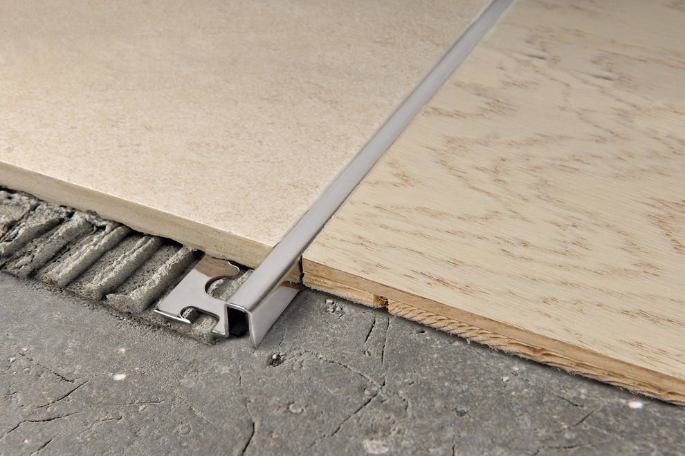 Стыковка плитки и ламината на полу — обзор способов соединения